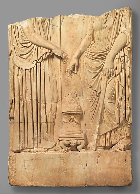 Lower part of a marble relief with two goddesses, related to Demeter and Persephone